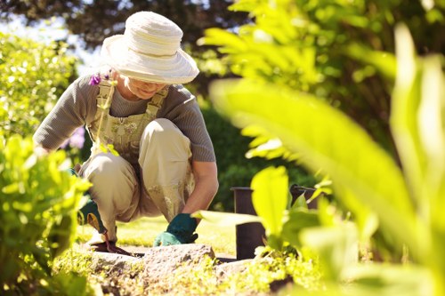Community gardener collecting green waste in Newham